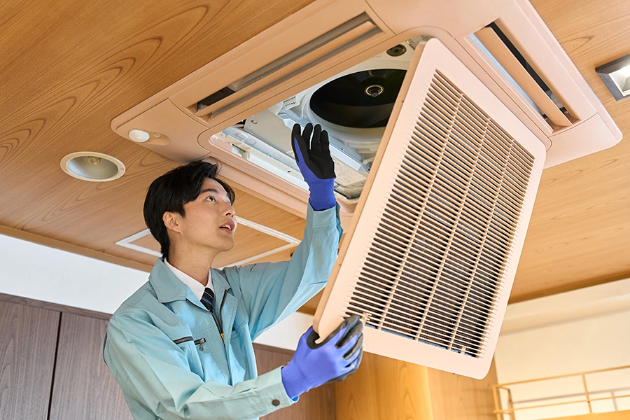 technician removing vent